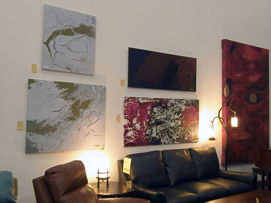 Shawn Gilmore's large paintings on display at his furniture store