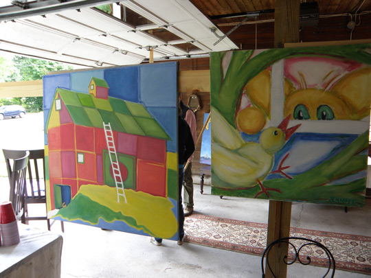 Vibrant paintings by Jennifer Hooley on display in the garage