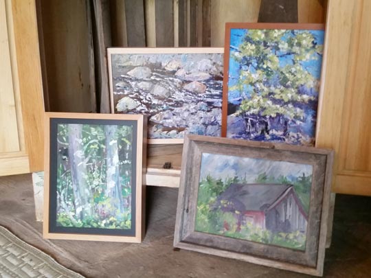 Several of Tom McCobb's paintings displayed in Tom's barn